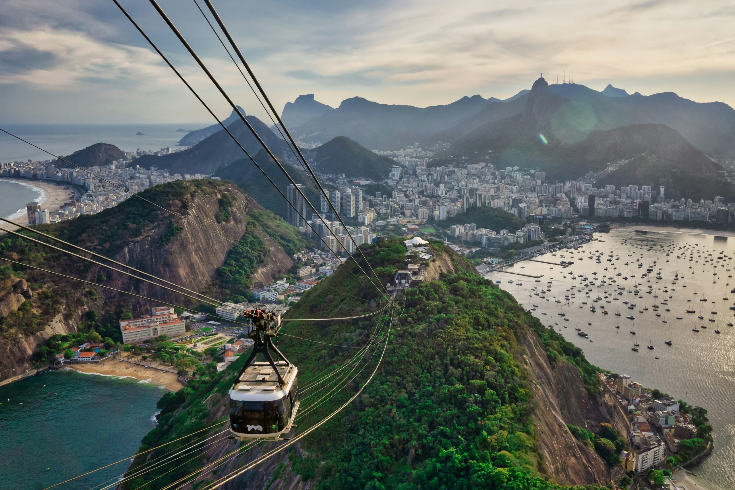 View from a cable car over Copacabana and downtown Rio de Janiero from sugar loaf mountain at golden hour. Rio de Janeiro, State of Rio de Janeiro, Brazil