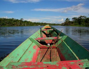 nareeta-martin-qv5qEo_R0fw-unsplash An old wooden row boat on the Amazon River, Amazon River near Manaus